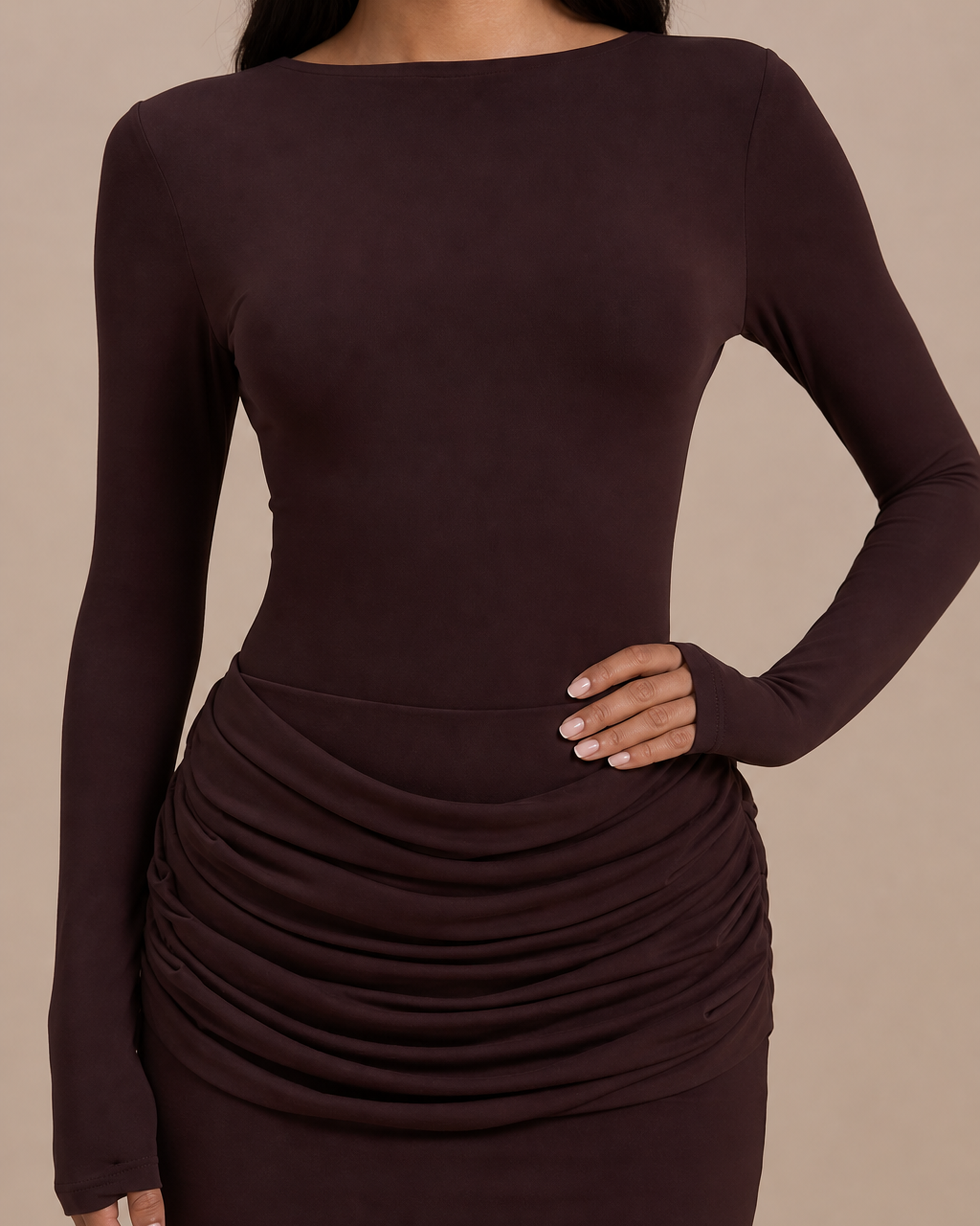 Close-up of the ruched hip detail and thumb-opening cuffs