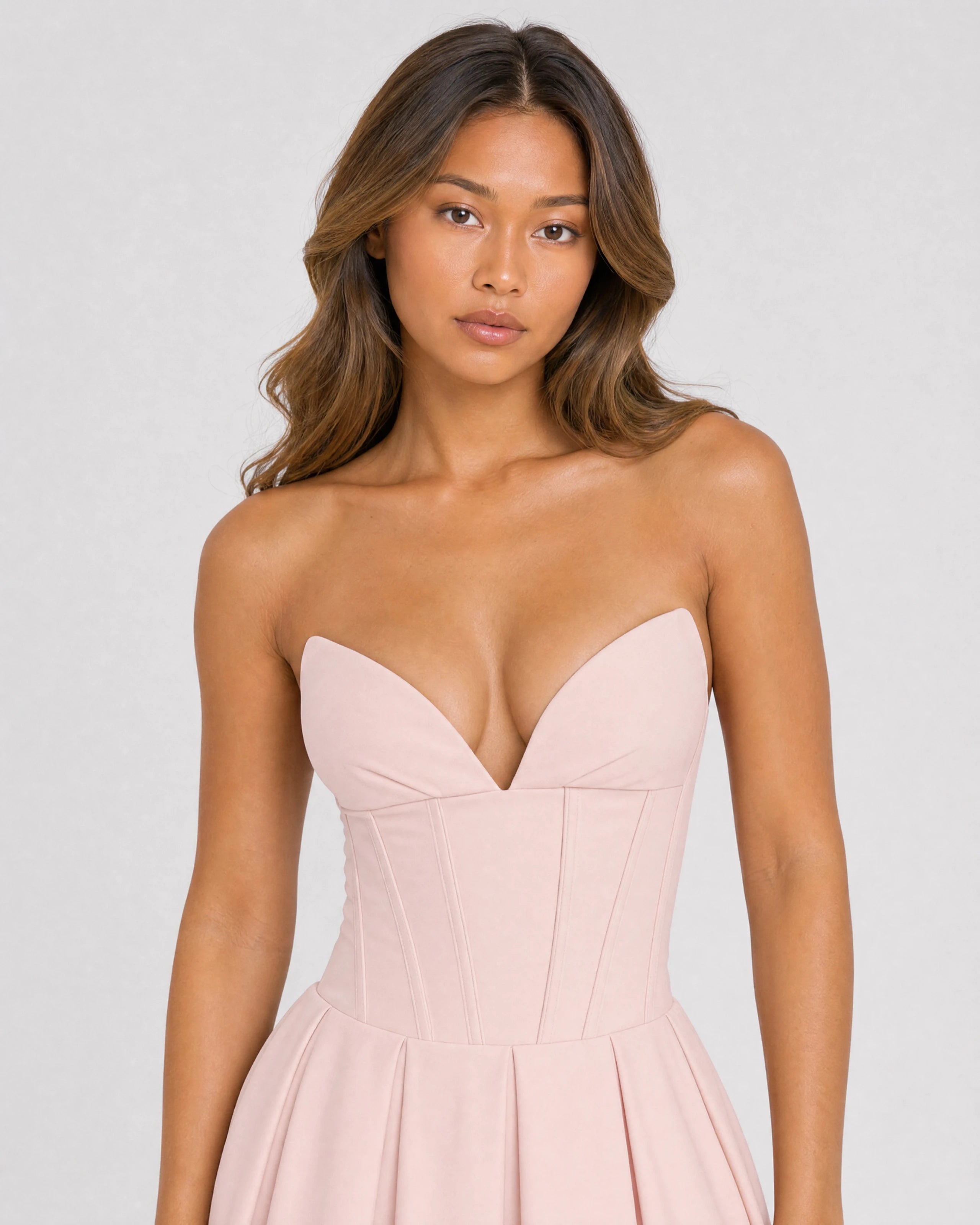 Adeline pink corset midi dress with full pleated skirt - waist-up close-up