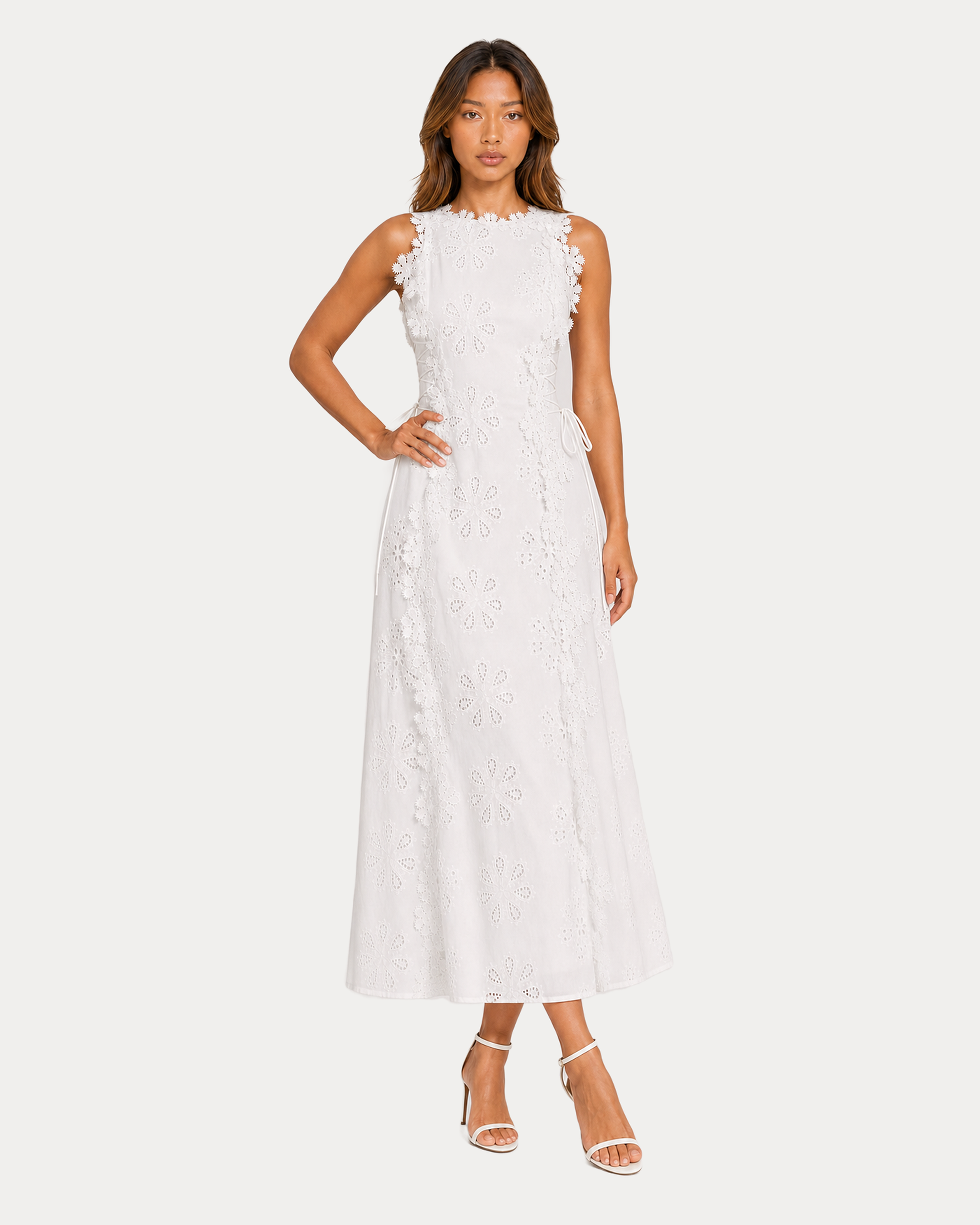 Front full-body view of the white floral eyelet embroidered A-line maxi dress